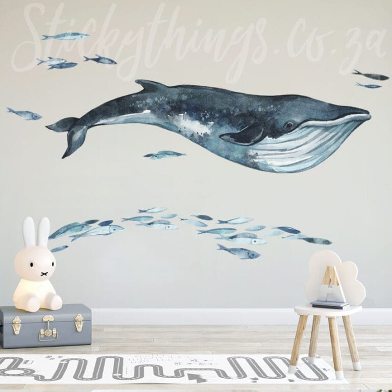giant whale wall decal with small fish around it