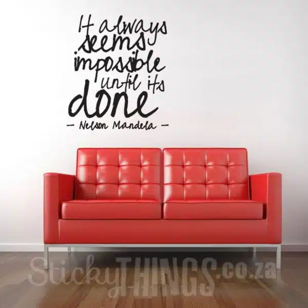 It always seems Impossible Quote above red couch