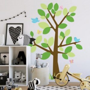 spot the tree wall sticker in colour next to a cupboard on white background