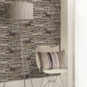 The stone mason wallpaper in brown with chair and light in front